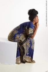 Dina Moses African Woman Sitting Pose